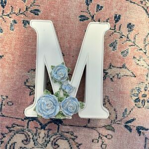 White Letter M with Blue Floral Accents